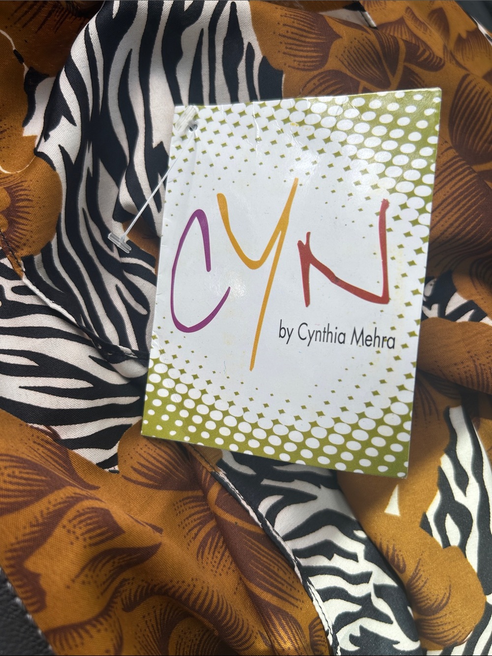 Cyn by Cynthia Mehra sarong/wrap features a bold brown, maroon and animal print